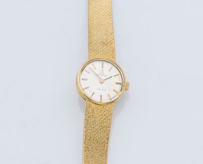 OMEGA Ladies' watch bracelet in 18K yellow gold (750 ‰), the round case with clipped...