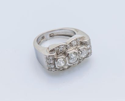 null Platinum (950 ‰) bridge ring set with three cushion diamonds, the largest approximately...
