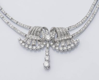 null 
A palladium half-set, consisting of a drapery necklace holding a symmetrical...