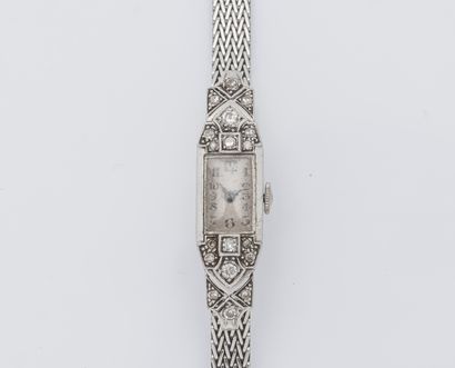 null Ladies' watch bracelet, the rectangular cutaway case in platinum (950 ‰) with...