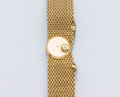 PIAGET Bracelet montre de dame en or jaune 18 carats (750 ‰) et platine (950 ‰)....
