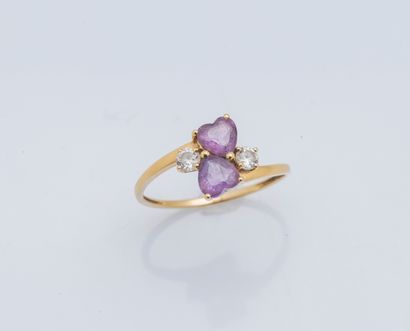 null 18K (750 ‰) yellow gold ring set with two heart-cut amethysts shouldered with...