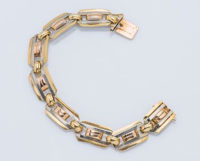 null Bracelet gourmette en or de trois couleurs 18 carats (750 ‰) composé de maillons...