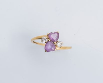 null 18K (750 ‰) yellow gold ring set with two heart-cut amethysts shouldered with...
