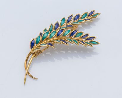 null Broche palme en or jaune 18 carats (750 ‰) à rehaut d’émail vert et bleu.

Largeur...