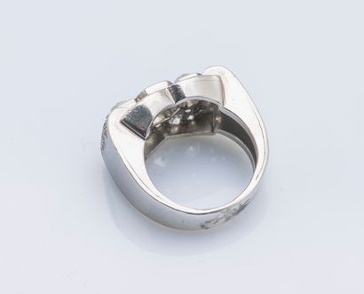 null Platinum (950 ‰) bridge ring set with three cushion diamonds, the largest approximately...