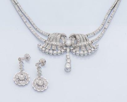 null 
A palladium half-set, consisting of a drapery necklace holding a symmetrical...