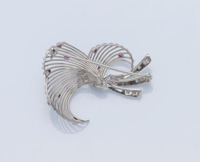 null 18K (750 ‰) white gold brooch styling a spray set with nine small rubies and...