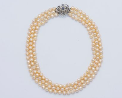 null Necklace of three rows of champagne-colored cultured pearls, diameter about...