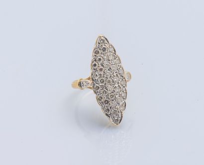 null An 18K yellow gold (750 ‰) marquise ring set with thirty-three round diamonds....