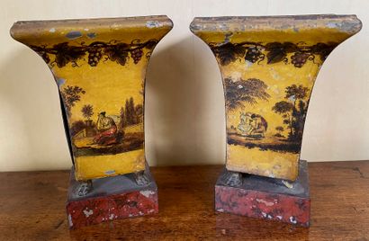 null A pair of painted sheet metal horn vases representing the allegory of the arts,...