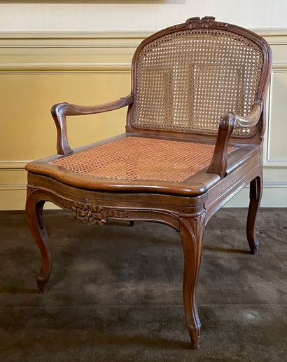 null Large armchair in natural wood, moulded and carved with ribbons decoration,...