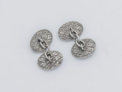  Pair of silver cufflinks (800 ‰) of oval shape with pampers decoration. French work....