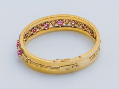 null Bracelet forming a rigid and opening flat band in 18K yellow gold (750 ‰) adorned...