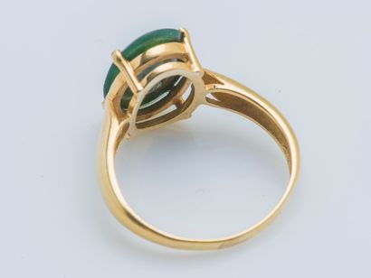 null An 18K (750 ‰) yellow gold ring set with an intaglio on blood jasper depicting...