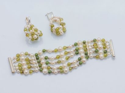 null Set comprising a pair of earrings and a matching bracelet composed of five rows...