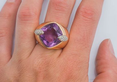  Important 18K yellow gold (750 ‰) dome ring set with a cushion amethyst shouldered...