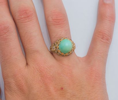 null An 18k yellow gold (750 ‰) dome ring set with a turquoise cabochon, the openwork...