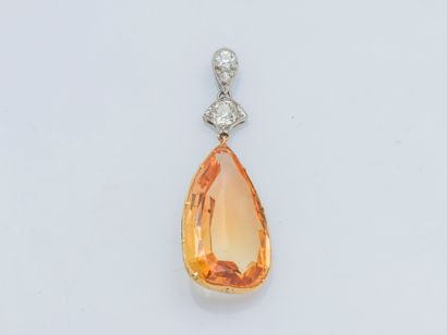 An 18k (750 ‰) yellow and white gold pendant...
