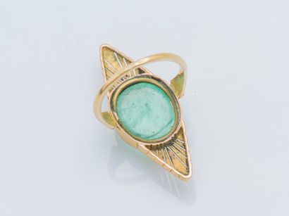  An 18k yellow gold (750 ‰) marquise ring set with a green quartz cabochon framed...