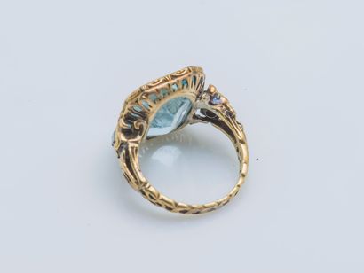  An 18k yellow gold (750 ‰) ring set with an approximately 7-carat rectangular aquamarine...
