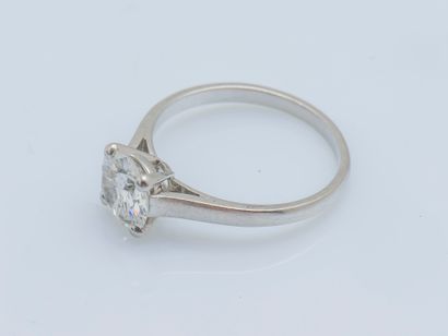 null 
Platinum (950 ‰) solitaire ring adorned with a half-cut diamond weighing approximately...