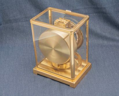 JAEGER-LECOULTRE Classic Atmos clock. Gilt metal cabinet, glass fronts. Cream dial...