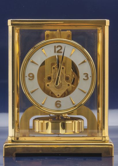 JAEGER-LECOULTRE Classic Atmos clock. Gilt metal cabinet, glass fronts. Cream dial...