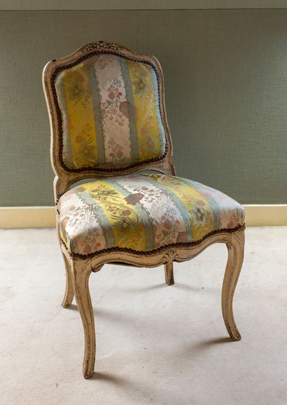 Chair in carved molded wood and cream lacquered...