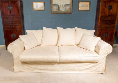 Comfortable three-seater sofa upholstered...
