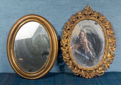 Set of two oval mirrors, one in gilded wood...