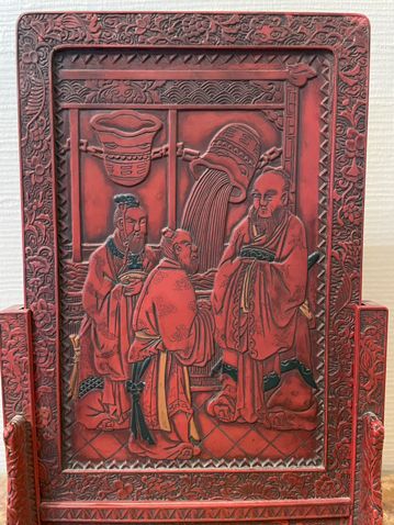 null A cinnabar lacquer scholar's screen, one side carved in light relief with the...