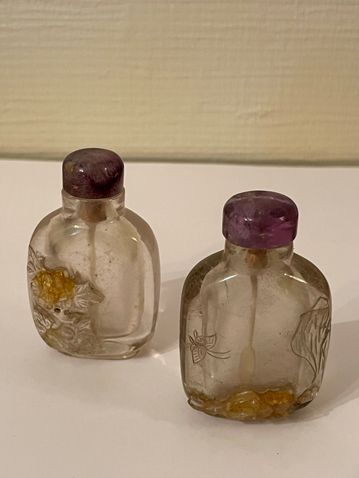 Two rock crystal snuff bottles with floral...