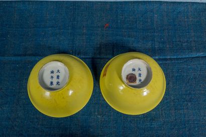 null Pair of porcelain bowls with yellow monochrome enamel, with Guangxu mark with...