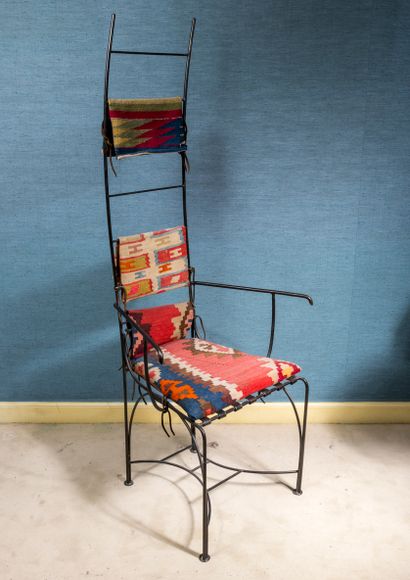Wrought iron chair, kilim carpet trim

149...