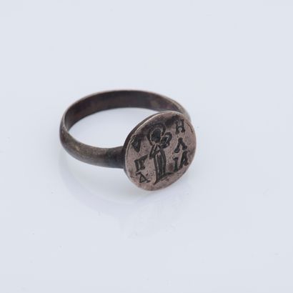null Silver ring (800 ‰) the round bezel engraved with a saint and Greek letters.

Finger...