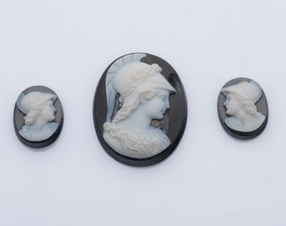 null Set of three cameos on onyx in their case with the form. Two cameos representing...