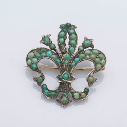 null 9K yellow gold (375 ‰) fleur-de-lis brooch fully set with turquoise cabochons...