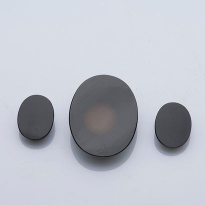 null Set of three cameos on onyx in their case with the form. Two cameos representing...