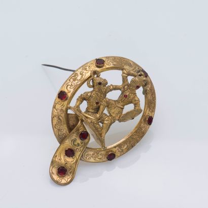 null Metal brooch depicting a fight scene set with garnets and pink stones, in a...
