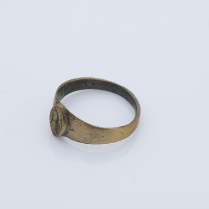 null Bronze ring decorated with a cartouche engraved with a stylized bird.

Finger...