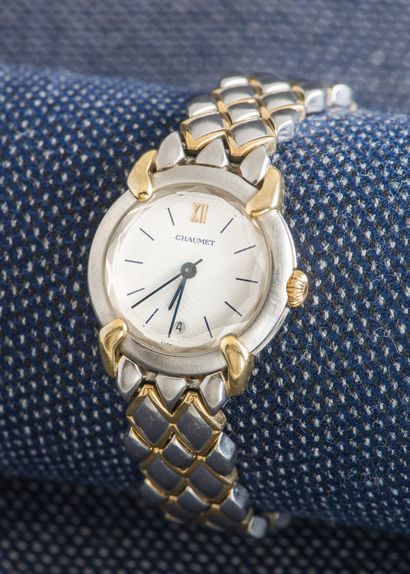 CHAUMET Bracelet montre de dame modèle Griffe Elysée en acier, les attaches en or...