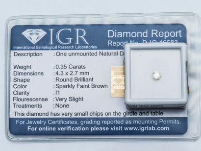 Un diamant rond sous scellé de 0,35 carat,...