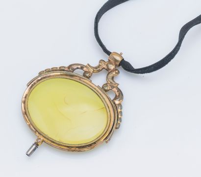 null Swinging watch key in gilded metal mounted in pendant, set with a hard stone...
