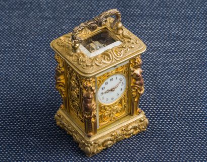 Gilt bronze travel clock (missing) of cabinet...