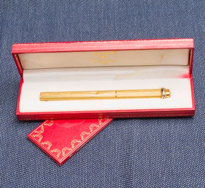 MUST de CARTIER Ballpoint pen model Trinity yellow gold plated with striated decoration,...