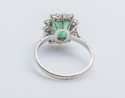 null Ring in 18K white gold (750 thousandths) set with a rectangular emerald with...