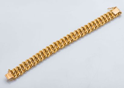 null 
Bracelet gourmette à maille américaine en or jaune 18 carats (750 millièmes)...