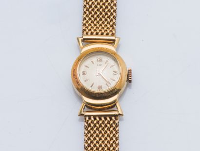 LIP 
Lady's watch in yellow gold 18 carats (750 thousandths). The round case with...