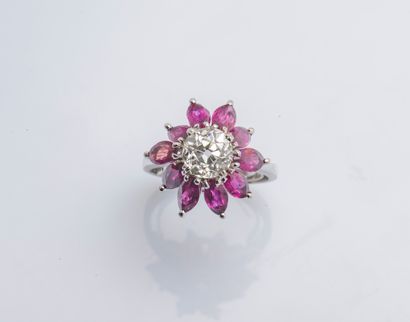 null Flower ring in white gold 18 carats (750 thousandths) set with a cushion diamond...